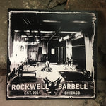 Square sticker with a black and white image of the original Rockwell Barbell gym.