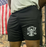 Model shown wearing black shorts with Rockwell Barbell circle logo.
