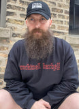 A man squatting in front of a brick wall. He is wearing the Established Crew sweatshirt. The text "Rockwell Barbell Est 2014" is in red, gothic lettering on the front of the shirt.